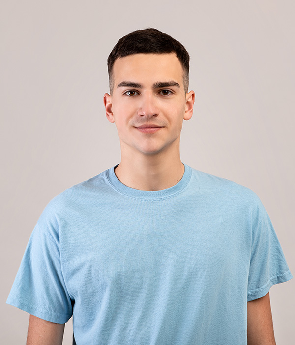 portrait-of-positive-young-guy-in-t-shirt-looking-GKPQ7BL.jpg